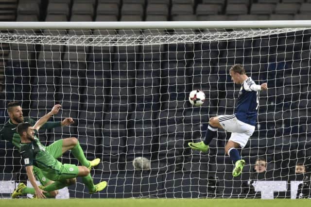 Leigh Griffiths sees his volley cannon off the crossbar. Picture: SNS