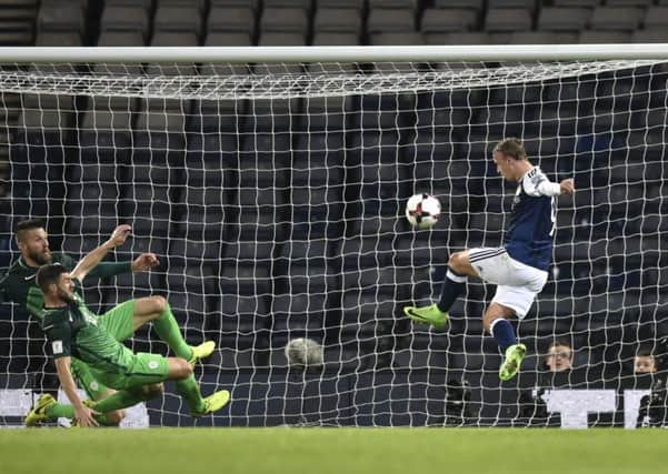 Leigh Griffiths sees his volley cannon off the crossbar. Picture: SNS