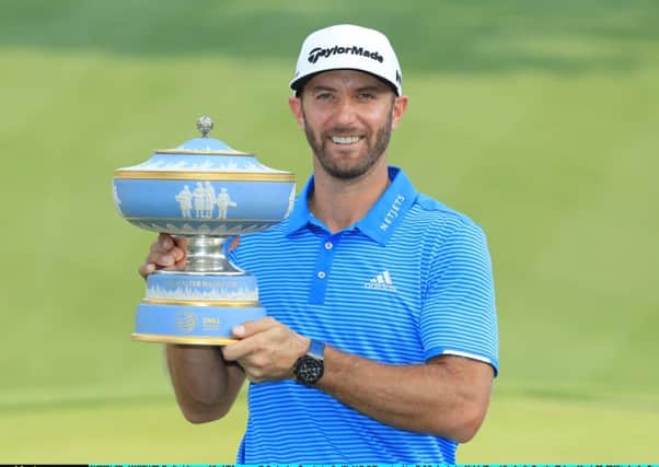 Dustin Johnson, with the WGC Dell Match Play trophy, is beginning to look invincible. Picture: Getty.