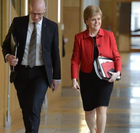 First Minister Nicola Sturgeon and deputy John Swinney arrive for a key vote on a Scottish Independence Referendum. Picture; PA
