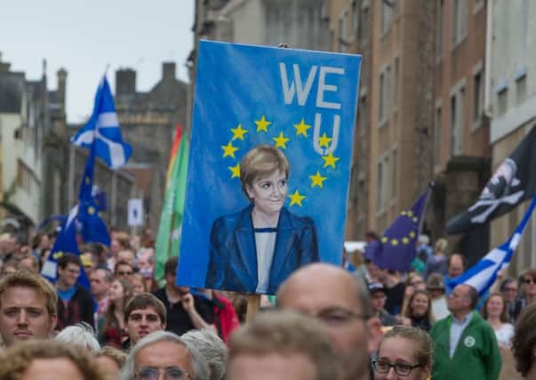 A pro-EU march heads down the Canongate in Edinburgh. Scottish attitudes towards Brexit are increasingly 'pessimistic', the SNP has said. Picture: Steven Scott Taylor/JP Resell
