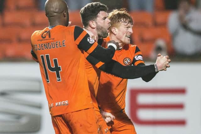 Dundee United's Mark Durnan, centre, celebrates his late winner against Ayr at Tannadice. Picture: SNS Group