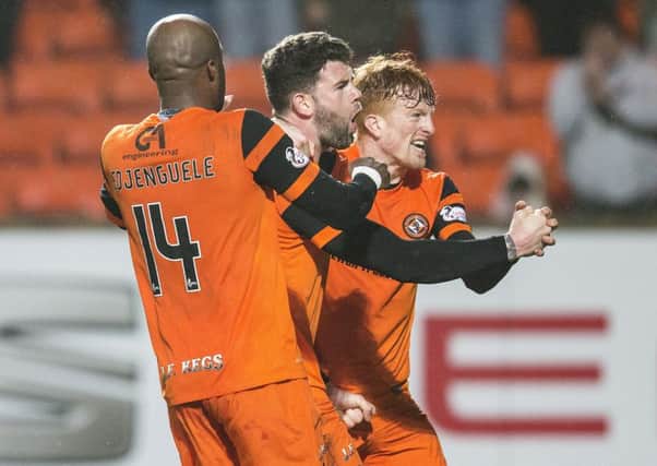 Dundee United's Mark Durnan, centre, celebrates his late winner against Ayr at Tannadice. Picture: SNS Group