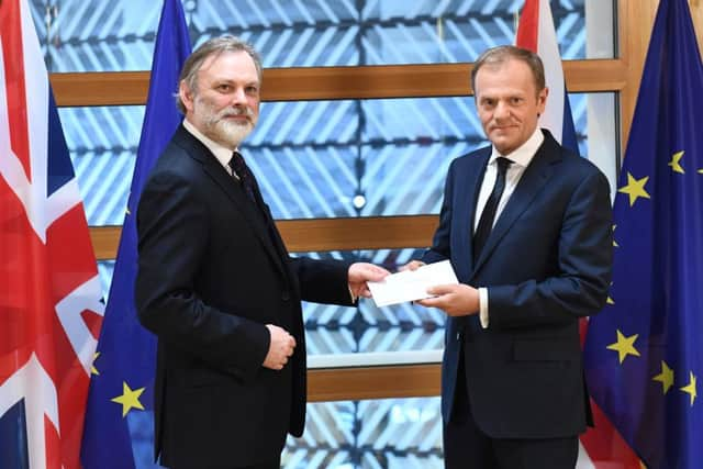 Britain's ambassador to the EU, Tim Barrow, delivers Theresa May's formal notice of the UK's intention to leave the bloc to European Council President Donald Tusk. Picture: AFP/Emmanuel Dunand/Getty Images