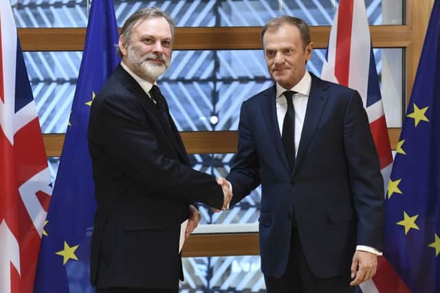Britain's ambassador to the EU, Tim Barrow, delivers Theresa May's formal notice of the UK's intention to leave the bloc to European Council President Donald Tusk. Picture: AFP/Emmanuel Dunand/Getty Images