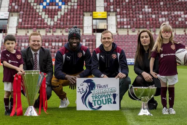 Young Hearts fans Jojo, left, and Skye, right, are pictured with Craig Wilson of Big Hearts, Isma Goncalves, Malaury Martin and SPFL Trust general manager Nicky Reid. Picture:
Craig Watson