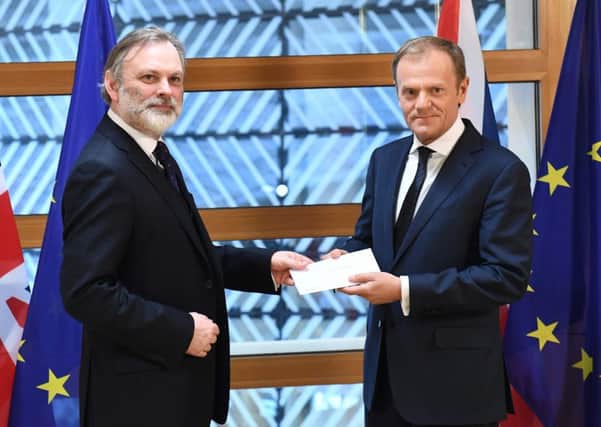 Britain's ambassador to the EU Tim Barrow delivers Theresa May's formal notice of the UK's intention to leave the bloc to European Council President Donald Tusk. Picture: Getty Images