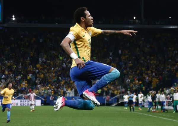 Brazil's forward Neymar celebrates after scoring in the 3-0 win against Paraguay in Sao Paulo. Picture: Miguel Schincariol/AFP/Getty Images
