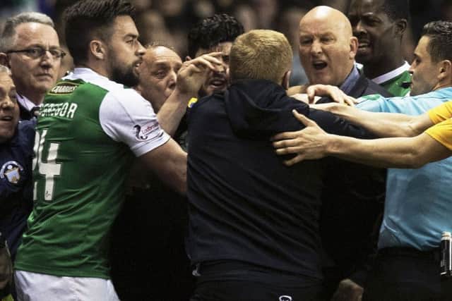Darren McGregor, later sent off himself, Hibs head coach Neil Lennon, centre, and Morton boss Jim Duffy during the flare-up. Picture: Ross MacDonald/SNS
