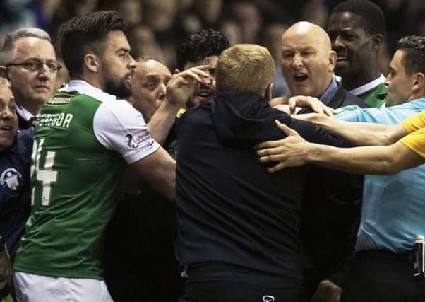 Darren McGregor, later sent off himself, Hibs head coach Neil Lennon, centre, and Morton boss Jim Duffy during the flare-up. Picture: Ross MacDonald/SNS