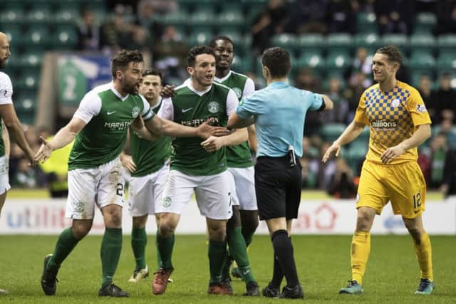 Hibernian players surround the referee after Darren McGregor (second from right) clashed with Morton's Kudus Oyenuga. Picture: Ross MacDonald/SNS