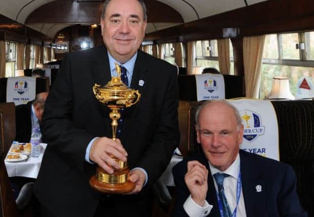 Sandy Jones, pictured with then First Minister Alex Salmond in the build up to the Gleneagles Ryder Cup, is confident the 2018 match will go ahead in France. Picture: Jane Barlow
