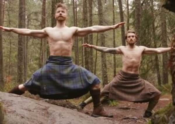Finlay Wilson, front, appears in the Kilted Yogi video alongside Tristan Cameron-Harper.