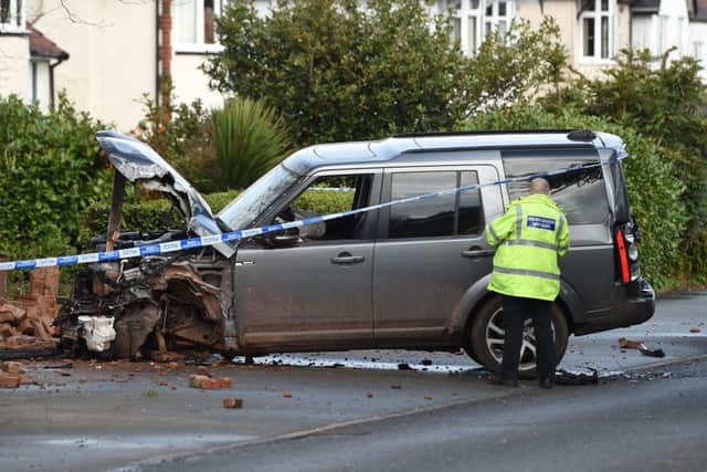 Police inspect a Land Rover stolen from the scene (Photo: Joe Giddens/PA Wire)