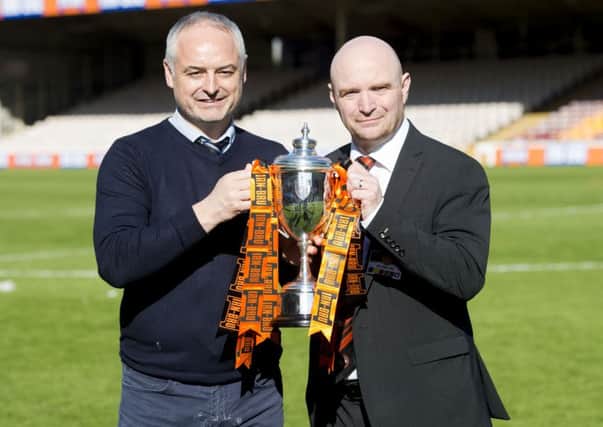 Chairman Stephen Thompson celebrates 
 Dundee United's Irn Bru Cup win with manager Ray McKinnon, left. Picture: Craig Foy/SNS