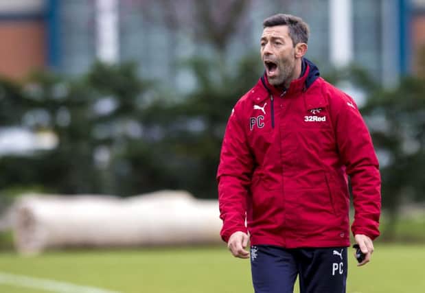 New Rangers manager Pedro Caixinha issues instructions as he takes training. Picture: SNS