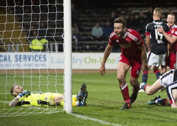 Aberdeen's Andy Considine celebrates after scoring his third goal in the rout of Dundee. Picture: Ross Parker/SNS