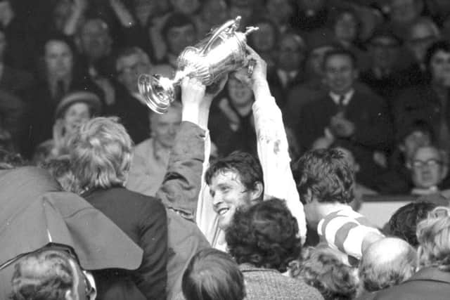 Celtic keeper Evan Williams holds up the trophy after his side defeated Hibs in the 1972 Scottish Cup final at Hampden. Picture: TSPL