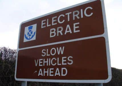 The sign warning of the weird goings-on at Electric Brae. Picture: Raymond Okonski [http://www.geograph.org.uk/profile/9875] (CC)