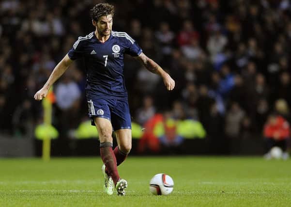 Charlie Mulgrew in action for Scotland in a friendly against England. Picture: John Devlin/SNS.