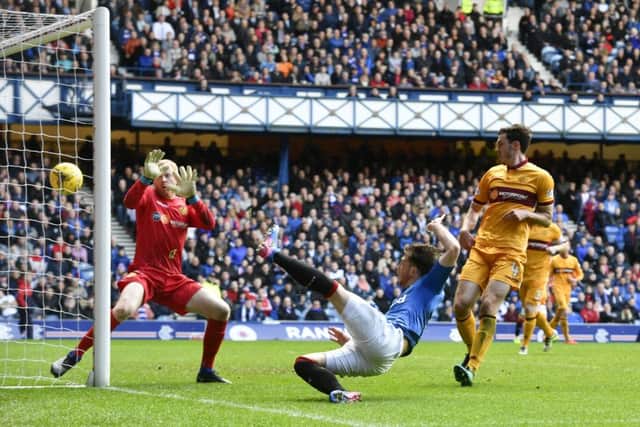 Joe Garner grabs Rangers' equaliser. Pic: SNS/Rob Casey