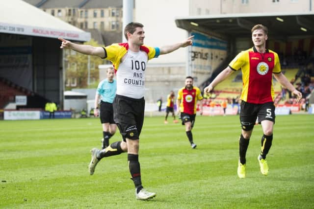 Kris Doolan celebrates his 100th goal for Partick Thistle. Pic: SNS/