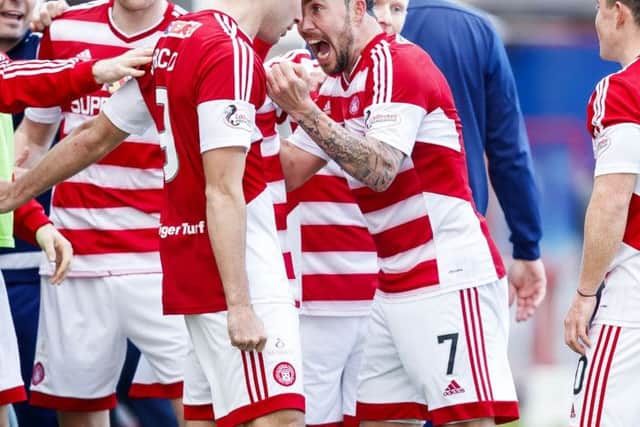 Dougie Imrie celebrates his side's winning goal with goal scorer Alex D'Acol. Pic: SNS/