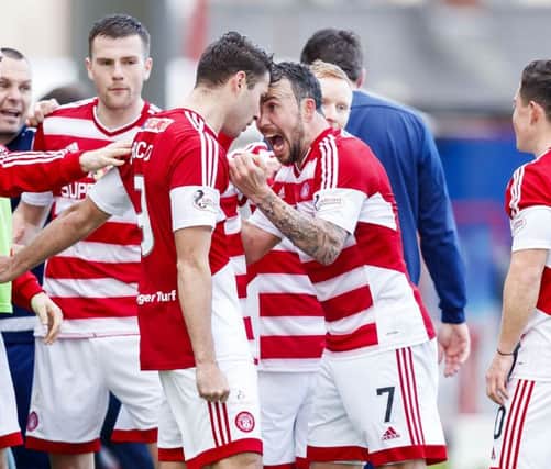 Dougie Imrie celebrates his side's winning goal with goal scorer Alex D'Acol. Pic: SNS/