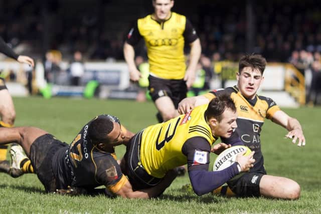 Nyle Godsmark scores Melroses third try. The centre also scored the second. Photograph: Graham Stuart SNS