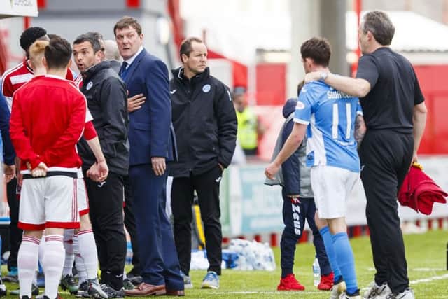Tempers flare as the teams go into the dressing room at half time. Picture: Roddy Scott/SNS