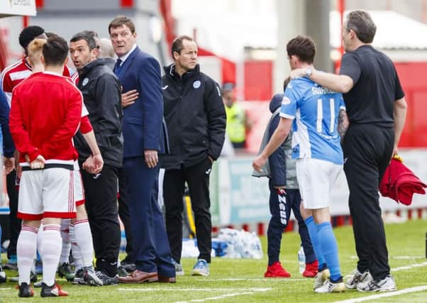 Tempers flare as the teams go into the dressing room at half time. Picture: Roddy Scott/SNS