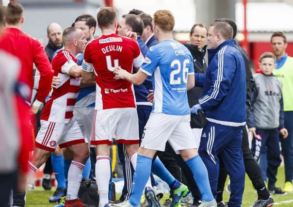 Tempers flare as the teams go into the dressing room at half-time. Picture: SNS