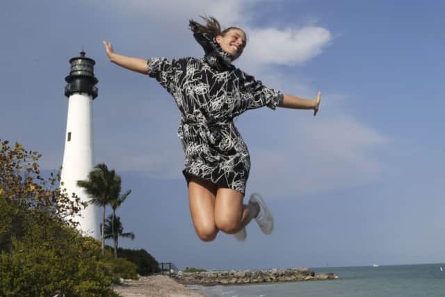 Johanna Konta enjoys her moment at the Cape Florida lighthouse after winning the Miami Open. Picture: AP.