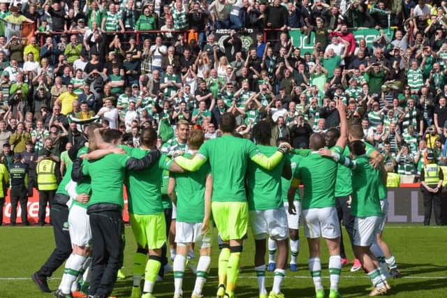 Celtic's players and fans celebrate at full-time. Picture: SNS