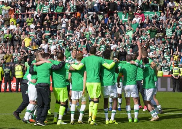 Celtic's players and fans celebrate at full-time. Picture: SNS