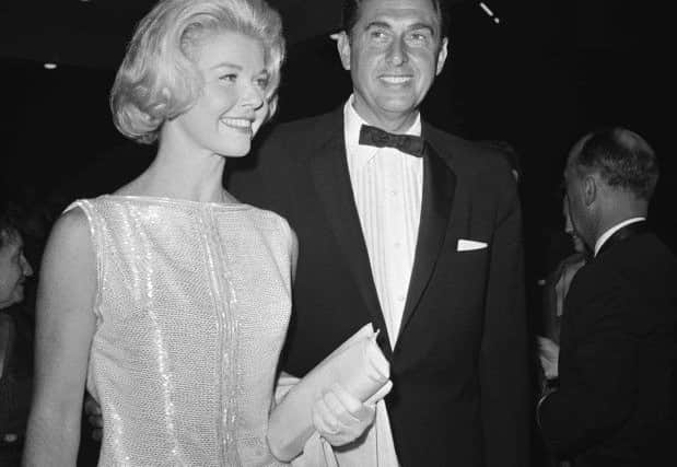 Doris Day, a best actress of the year nominee for her role in "Pillow Talk," and her producer husband Marty Melcher, arrive for the 1960 Academy Awards  (AP Photo, File)