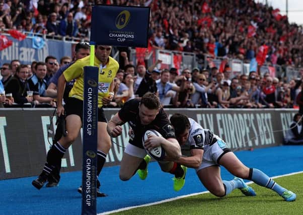Lee Jones makes a try-saving tackle on Saracens' Chris Ashton. The Warriors wing says his team's focus is now firmly back on the Pro12. Picture: Getty