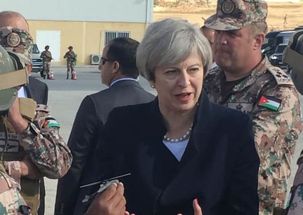Theresa May speaks to troops as she arrives in Ammam, Jordan. Picture: PA