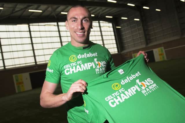 Celtic captain Scott Brown celebrates the club securing the Ladbrokes Premiership title. Picture: SNS.