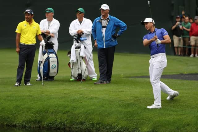Scotland's Sandy Lyle watches on as world No 3 Jason Day plays a shot on the 16th hole during practice at Augusta yesterday. Picture: Rob Carr/Getty