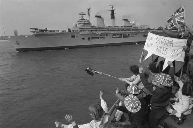 Royal Navy aircraft carrier HMS Invincible leaving Portsmouth to a patriotic send-off. She is to lead the task force to the Falkland Islands.