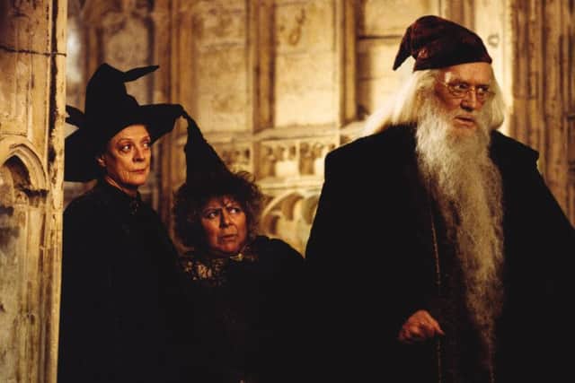Harris, as Dumbledore, pictured with Maggie Smith (left) and Miriam Margolyes in the second Harry Potter film. Picture: Warner Bros
