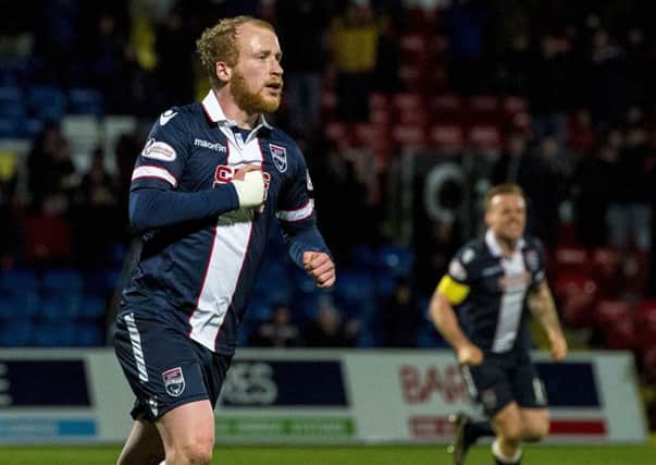 Ross County's Liam Boyce celebrates scoring a late penalty to make it 2-1 against Dundee. Picture: SNS Group