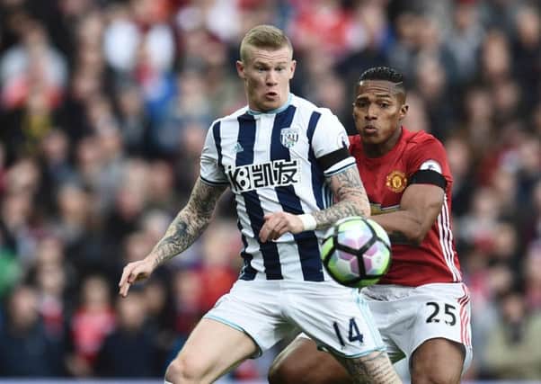James McClean, left, posted a picture of Instagram of him wearing a Celtic top. Picture: AFP