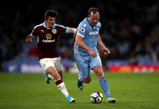 Charlie Adam, right, made the error while playing for Stoke against Burnley. Picture: PA
