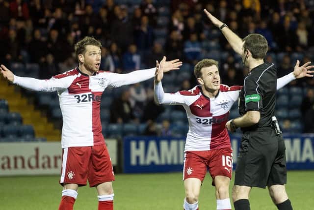 Rangers' Joe Garner and Andy Halliday appeal to referee Alan Muir. Picture: SNS