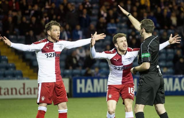 Rangers' Joe Garner and Andy Halliday appeal to referee Alan Muir. Picture: SNS
