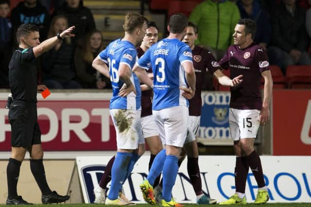 Referee Nick Walsh dismisses Hearts winger Sam Nicholson (second from right) in the second half at McDiarmid Park. Picture: SNS