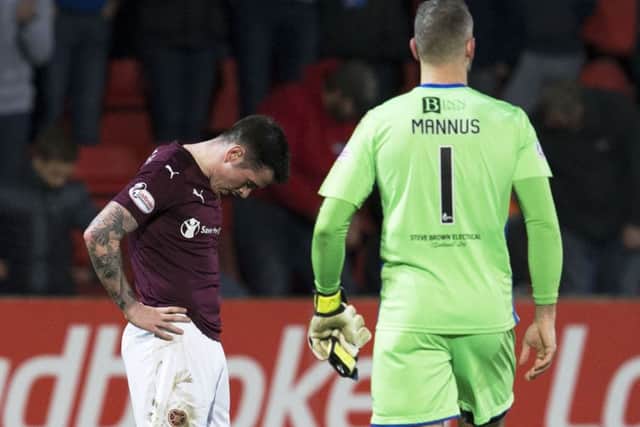 Hearts' Jamie walker (left) is dejected at full-time. Picture: SNS