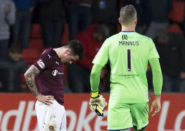 Hearts' Jamie walker (left) is dejected at full-time. Picture: SNS